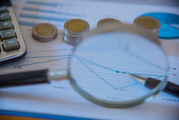 A close-up of a credit report with highlighted sections showing payment history, credit utilization, and account balances. A magnifying glass hovers over the report, symbolizing scrutiny and analysis.