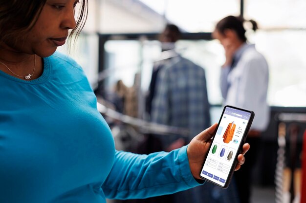 A person using a mobile app to set up automated transfers to their diverse investment portfolio, showcasing the convenience and control provided by modern investment platforms.