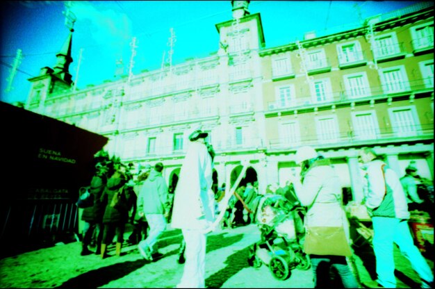 A split image showing opposing groups protesting for and against immigration reform outside a government building.