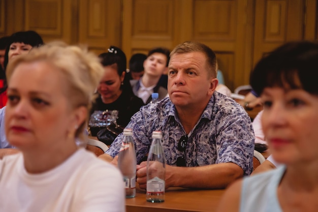 A photo of congressional members seated at a long table during a budget hearing, emphasizing the seriousness and detailed nature of the discussions.