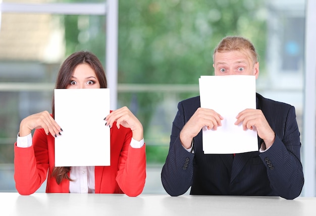 A split image showing on one side a candidate reading a job description with a confused expression, and on the other side, a candidate confidently highlighting key areas with a pen and displaying a knowing smile.