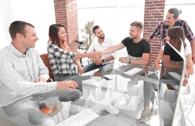 A group of colleagues collaborating on a project in a brightly lit office. They are gathered around a whiteboard, brainstorming ideas and discussing solutions.