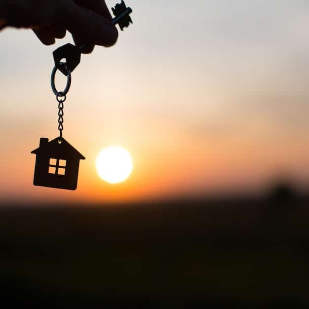 An image showing a hand holding keys in front of a house, with a small family silhouette visible through the window.
