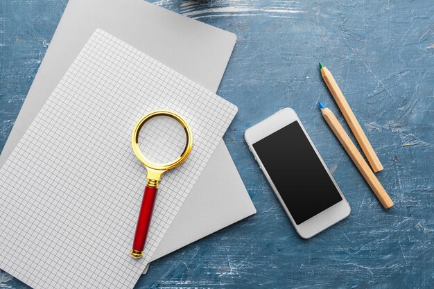 A close-up shot of an application form with a pen resting on it, symbolizing the process of applying for US benefits programs, with magnifying glass focusing on the important details.
