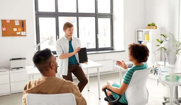 A therapist sitting across from a young student in a brightly lit office. The student is looking down, appearing thoughtful and slightly distressed, while the therapist is listening attentively with a supportive expression.