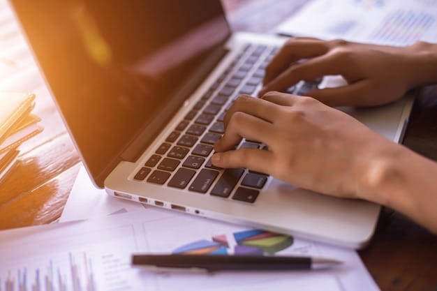 A close-up image of hands typing on a laptop, focused on financial aid application forms, highlighting the importance of diligent research and accurate information.