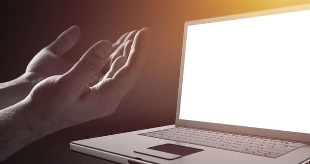 A close-up of a computer screen displaying the FAFSA website, with a hand hovering over the 
