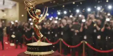 Golden Emmy statuette on a red carpet, symbolizing TV awards season.